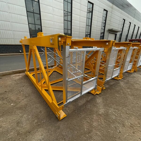 Yellow construction scaffolding components and an IHURMO china flat top tower crane are positioned outside a building.