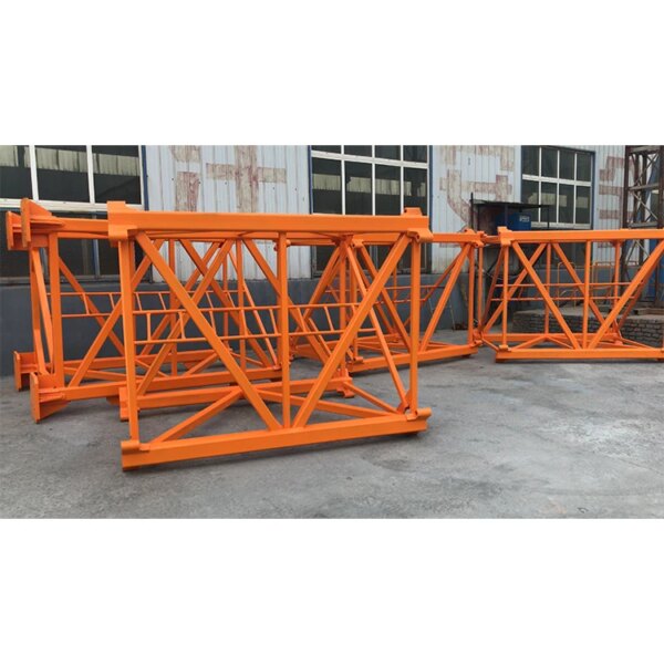 Orange IHURMO CE certificate self-erecting Qtz80 5612 6T construction hammerhead tower crane stacked on concrete ground.