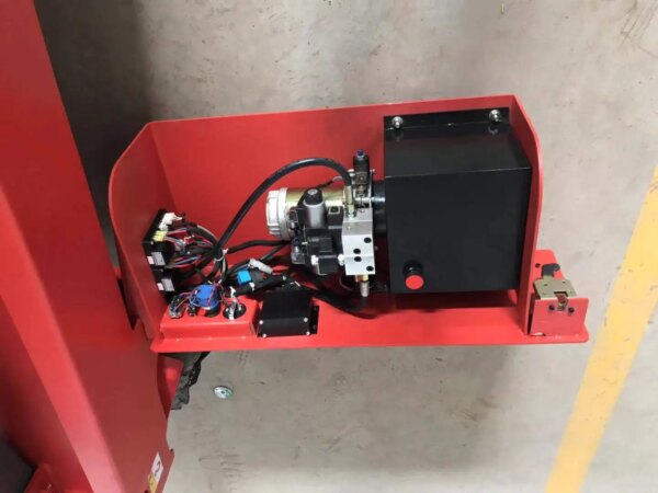 Industrial machinery component mounted on a red bracket of an IHURMO Mobile Self Propelled Scissor Lift.