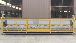 Heavy-duty suspended scaffold with safety harness attachment points, designed for building maintenance and high-rise construction projects.